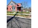 Beautiful two-story home with a covered porch, lovely bay window, and professionally landscaped yard at 359 N Jefferson St, Martinsville, IN 46151