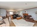 Inviting living room with a fireplace and a cozy seating arrangement on decorative rug at 464 Hummingbird Ln, Whiteland, IN 46184