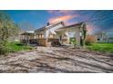 Exterior view of a house with stone accents, a car port and large gravel driveway at 5196 N London Rd, Fairland, IN 46126