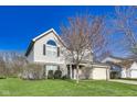 Charming two-story home with a well-maintained lawn and attached two-car garage at 5397 Ripplingbrook Way, Carmel, IN 46033
