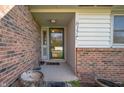 Inviting front entrance with brick accents, covered porch, and the house number prominently displayed at 617 Kokomo Ln, Indianapolis, IN 46241
