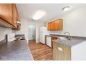Functional kitchen with wood cabinets and essential appliances for easy meal preparation at 693 Cembra Dr, Greenwood, IN 46143