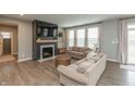 Inviting living room with a fireplace, neutral decor, and plenty of natural light at 8160 Shaldon Ct, Zionsville, IN 46077