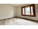 Bright bedroom with a large window offering a picturesque view, and neutral carpeting at 8616 Old Dominion Ct, Indianapolis, IN 46231