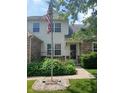 Home entrance with lush green plants and colorful flowers that create a warm, inviting, and beautiful curb appeal at 10629 Simsbury Ct, Indianapolis, IN 46236