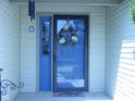 Charming front door with decorative wreath and sidelight window at 10916 President Cir, Indianapolis, IN 46229