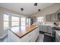 Spacious kitchen featuring stainless steel appliances, updated cabinets, and a large island at 1231 Chesterfield Dr, Anderson, IN 46012