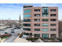 Contemporary building exterior featuring upscale architecture, gated entry and ample parking at 225 N New Jersey St # Apt 48, Indianapolis, IN 46204