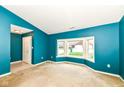 Bright living room with a bay window and a view of the front yard at 229 Waterford Ct, Avon, IN 46123