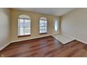 Inviting living room features arched windows and easy access to the front entryway at 2606 Bristlecone Dr, Indianapolis, IN 46217