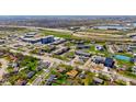 High aerial view showcasing the neighborhood, nearby businesses, commercial area, and highway interchange and overpass at 2753 N High School Rd, Indianapolis, IN 46224