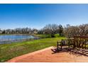 Enjoy a peaceful backyard view with a wooden deck and serene lake, perfect for relaxation at 3634 W 58Th St, Indianapolis, IN 46228