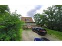 A home with a deck in the backyard and an adjacent parking area at 3818 Graceland Ave, Indianapolis, IN 46208