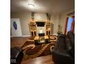 Inviting living room boasts hardwood floors and a cozy seating arrangement at 3818 Graceland Ave, Indianapolis, IN 46208