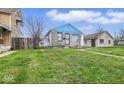Cozy single-story home with a well-maintained lawn, showcasing the property's charming curb appeal at 3924 E 30Th St, Indianapolis, IN 46218