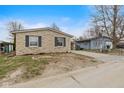 A stone-clad house with neat, dark shutters and a simple yet stylish design at 49 Fountain Lake Dr, Greenfield, IN 46140