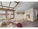 Cozy living room featuring a unique paneled ceiling and ample natural light at 49 Fountain Lake Dr, Greenfield, IN 46140