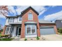 Beautiful two-story home featuring brick and vinyl siding with an attached garage in a suburban neighborhood at 716 Bristol Ct, Greenwood, IN 46143