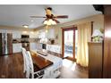 Eat-in kitchen featuring stainless steel appliances, and access to the backyard at 7608 Andrew Turn, Plainfield, IN 46168