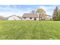 Expansive backyard with lush green grass, perfect for outdoor activities and relaxation at 7715 High View Cir, Indianapolis, IN 46236