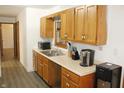 Functional kitchen featuring wooden cabinets and modern appliances for convenient meal preparation at 7740 5 Points Rd, Indianapolis, IN 46259