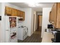 Well-lit kitchen with updated appliances and ample counter space for cooking and meal prep at 7740 5 Points Rd, Indianapolis, IN 46259