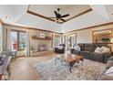 Spacious living room featuring a cozy fireplace, wood accents and trey ceilings at 8095 Christopher Ct, Avon, IN 46123