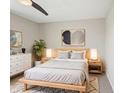 Serene bedroom with minimalist decor, neutral tones, wooden bed frame, and soft rug at 8235 Picadilly Ln, Indianapolis, IN 46256