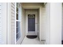 Front door view with a decorative window and classic design at 10047 Perlita Pl, Fishers, IN 46038