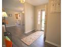 Welcoming entryway with gray flooring and a view into the kitchen at 1121 Canterbury Ct, Indianapolis, IN 46260
