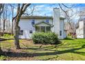 The backyard features mature trees and a screened porch, offering a private outdoor space at 11249 Tall Trees Dr, Fishers, IN 46038
