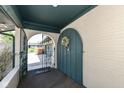 Inviting front entrance with tiled floor, an arched wrought iron gate, and a colorful floral wreath at 1153 Diablo Rd, Greenwood, IN 46143