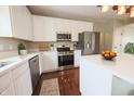Bright kitchen with stainless steel appliances, white cabinetry, and quartz countertops at 12332 Cobblefield Ct, Fishers, IN 46037