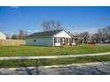 Charming brick home with lawn and sidewalk at 126 Windemere Rd, Whiteland, IN 46184
