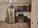 Well-lit kitchen featuring stainless steel appliances and ample cabinet space for storage at 1317 Mulberry Ct, Greenfield, IN 46140