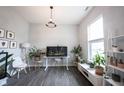 Stylish living room featuring a large window, modern decor, and natural lighting at 1534 Cloverdon Dr, Westfield, IN 46074