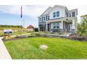Beautiful two-story home with lush green lawn and manicured landscaping at 1571 Beyers St, Fortville, IN 46040