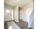 Bright foyer with hardwood floors and a staircase leading to the upper level at 1571 Beyers St, Fortville, IN 46040
