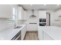 Light and airy kitchen showcasing an island, white cabinets, stainless steel appliances, and ample counter space at 18944 Seaforth Way, Westfield, IN 46074