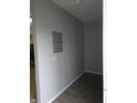 Hallway with gray walls, leading to other rooms at 1931 Brentwood Dr, Anderson, IN 46011