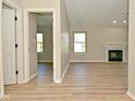Bright living room with wood flooring and a fireplace, offering a cozy atmosphere at 2206 Tansel Crossing Cir, Indianapolis, IN 46234