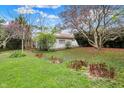 Spacious backyard featuring established tree, plants, and greenery at 2330 Harlan St, Indianapolis, IN 46203