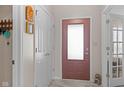 Inviting entryway featuring a modern front door, a coat closet, and neutral wall tones at 3627 Miesha Dr, Indianapolis, IN 46217