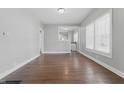 This dining room boasts a window with hardwood floors and fresh, clean walls at 402 W 38Th St, Indianapolis, IN 46208