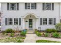 Close-up of the front entrance, showcasing meticulous landscaping and a charming doorway at 4451 N Washington Blvd, Indianapolis, IN 46205