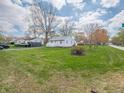 A cozy home with lush green lawn and a convenient, attached one-car garage at 4897 Walker St, Greenwood, IN 46143