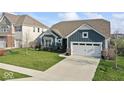 Charming single-Gathering home with a well-manicured lawn, attached two-car garage, and inviting curb appeal at 5178 Aegis Dr, Noblesville, IN 46062