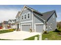Beautiful two-story home showcasing a two-car garage, manicured lawn, and classic gray siding at 5300 Veranda Dr, Noblesville, IN 46062