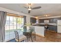 Eat-in kitchen features dark cabinets, stainless steel appliances, and sliding door to patio at 82 Pin Oak Ct, Whiteland, IN 46184