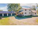Two-story home boasts an attached three-car garage and covered porch at 9056 E 650 N, Wilkinson, IN 46186